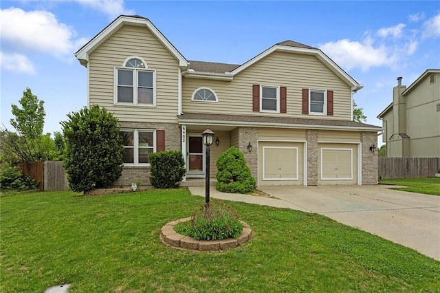 traditional-style house featuring brick siding, a garage, fence, and concrete driveway