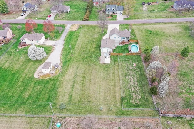 birds eye view of property with a residential view
