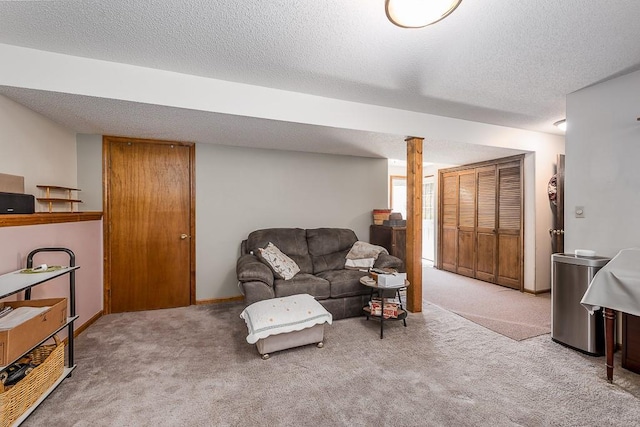 living area featuring carpet and a textured ceiling