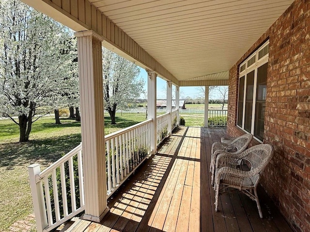 wooden terrace with a porch