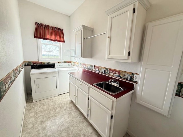 washroom featuring washer and dryer, a sink, light floors, and cabinet space