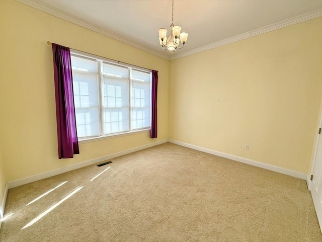 empty room with visible vents, baseboards, a notable chandelier, crown molding, and carpet floors