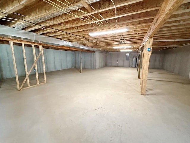 unfinished below grade area featuring gas water heater