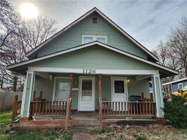 1126 S Pearl St, Independence, MO 64050 - view of front of house with covered porch and fence