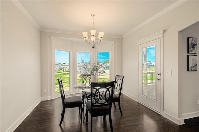 dining space with dark wood-style flooring, a wealth of natural light, and a chandelier