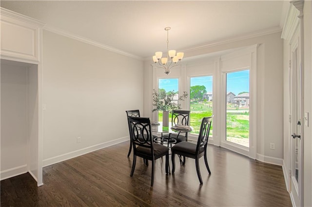 dining area with baseboards, ornamental molding, a chandelier, and dark wood finished floors