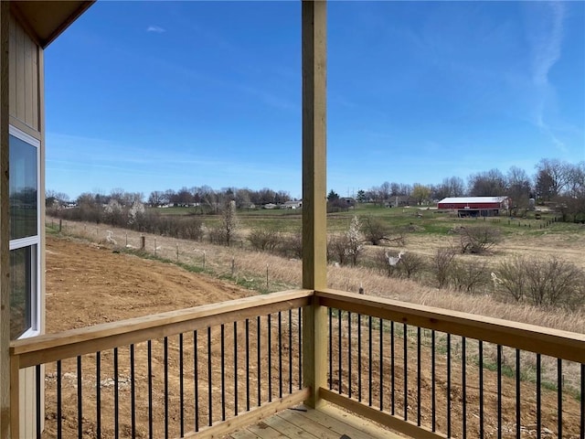 wooden terrace with a rural view