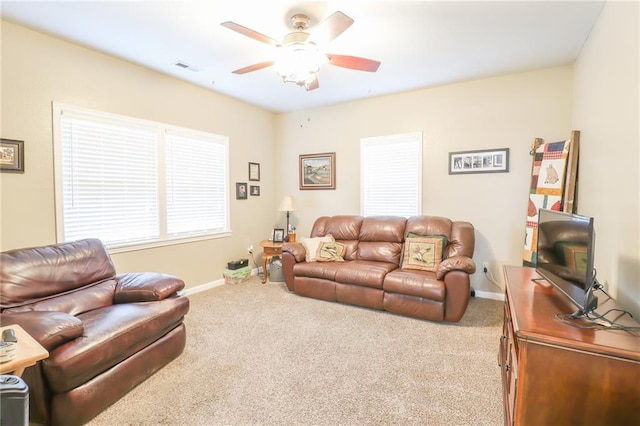 1404 S Market St, Holden, MO 64040 - carpeted living room with a ceiling fan and baseboards