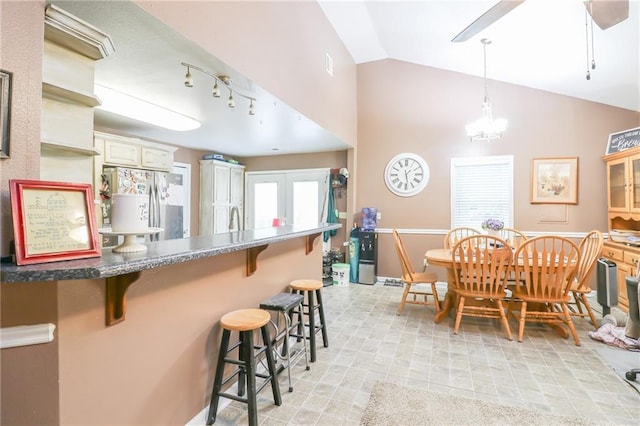 1404 S Market St, Holden, MO 64040 - dining space featuring lofted ceiling and a chandelier