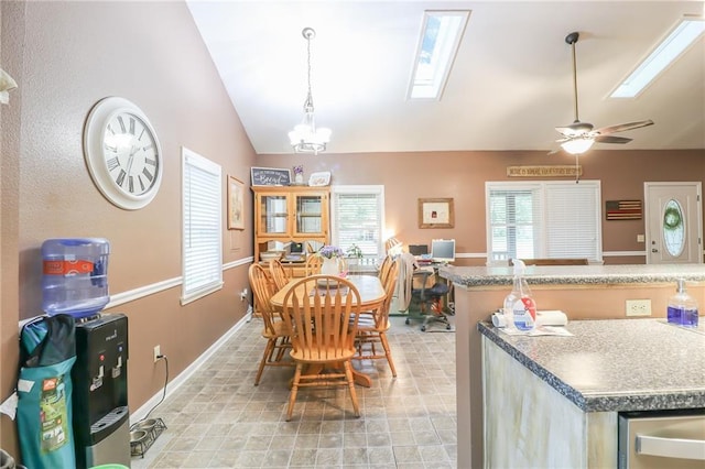 1404 S Market St, Holden, MO 64040 - dining space with lofted ceiling, healthy amount of natural light, a skylight, baseboards, and a chandelier