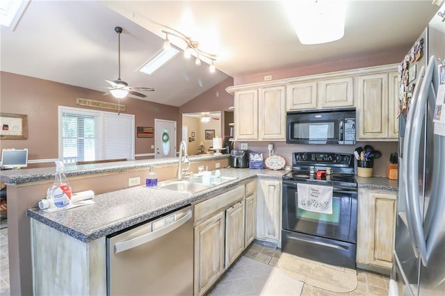 1404 S Market St, Holden, MO 64040 - kitchen featuring black appliances, a sink, lofted ceiling, a peninsula, and a ceiling fan