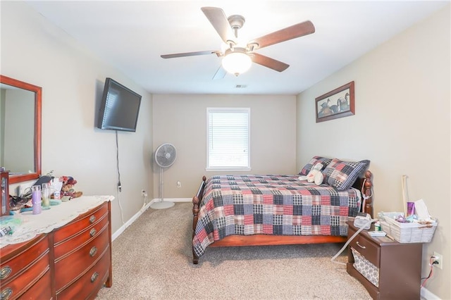 1404 S Market St, Holden, MO 64040 - bedroom featuring light colored carpet, baseboards, and a ceiling fan