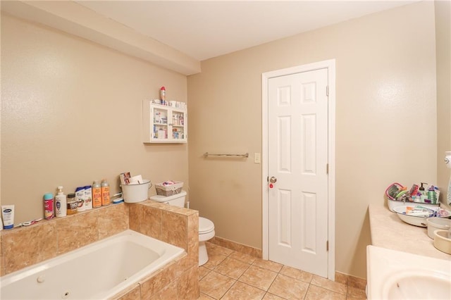 1404 S Market St, Holden, MO 64040 - bathroom with a jetted tub, tile patterned floors, and toilet