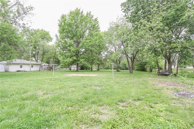 1404 S Market St, Holden, MO 64040 - view of grassy yard with view of wooded area