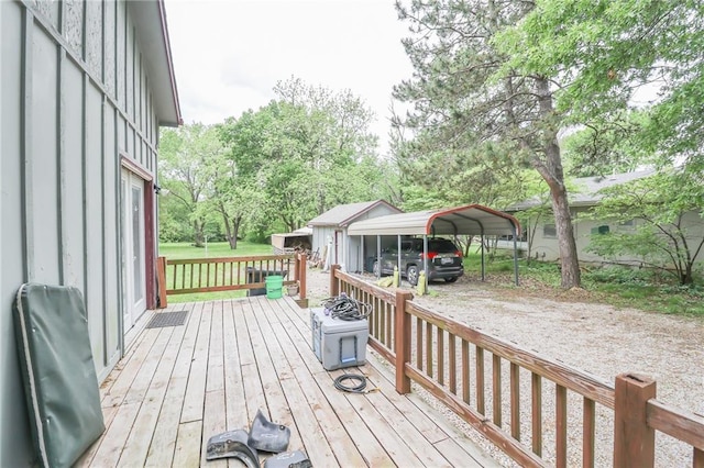 1404 S Market St, Holden, MO 64040 - wooden deck featuring a carport, view of scattered trees, and driveway