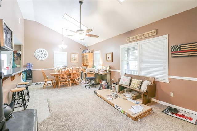 1404 S Market St, Holden, MO 64040 - living room featuring vaulted ceiling, a ceiling fan, carpet, and a chandelier