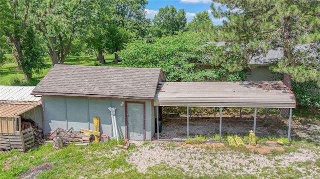 1404 S Market St, Holden, MO 64040 - view of outbuilding featuring a carport