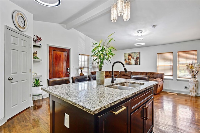 2705 Endicott Ave, Kansas City, KS 66104 - kitchen featuring a sink, lofted ceiling with beams, dark wood-style floors, and a wealth of natural light