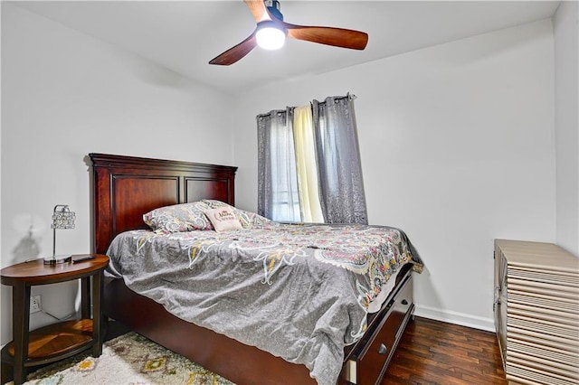 2705 Endicott Ave, Kansas City, KS 66104 - bedroom with baseboards, ceiling fan, and wood finished floors