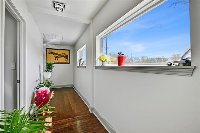 2705 Endicott Ave, Kansas City, KS 66104 - hallway featuring dark wood-style floors, baseboards, and visible vents