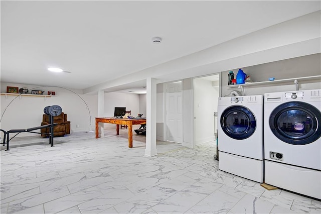 2705 Endicott Ave, Kansas City, KS 66104 - laundry area with baseboards, marble finish floor, washing machine and dryer, and laundry area