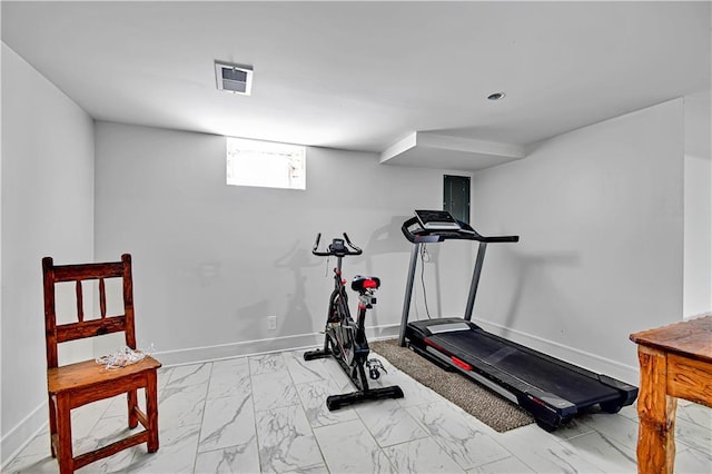 2705 Endicott Ave, Kansas City, KS 66104 - exercise room featuring baseboards, marble finish floor, and visible vents
