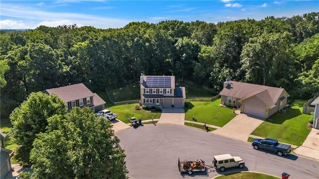 drone / aerial view featuring a view of trees