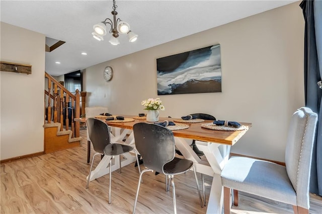 dining area with stairs, recessed lighting, an inviting chandelier, baseboards, and light wood-style floors