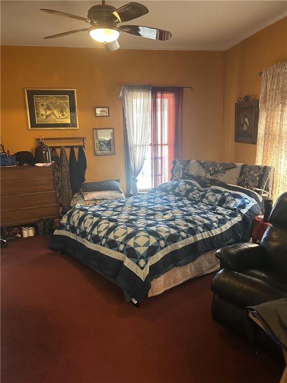 bedroom featuring carpet flooring and a ceiling fan