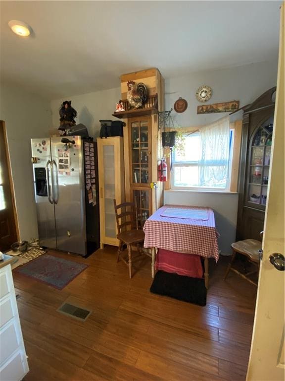 dining area with wood finished floors