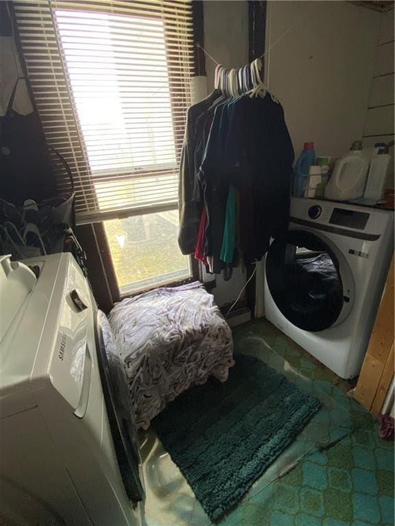 laundry area featuring laundry area and washer / dryer