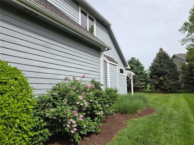 view of home's exterior featuring a yard