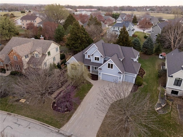 birds eye view of property with a residential view