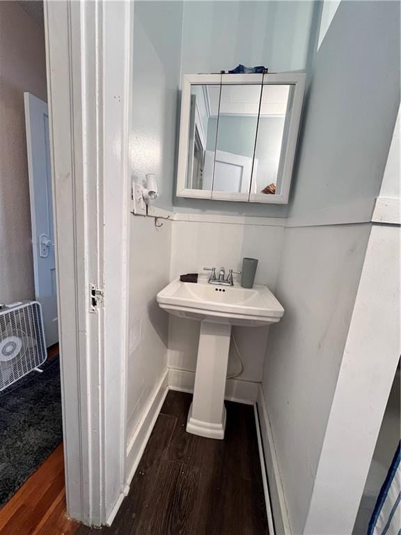 bathroom featuring baseboards and wood finished floors