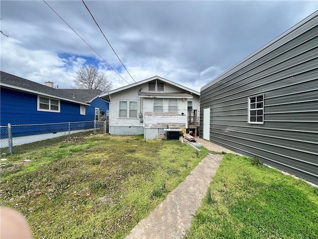 exterior space featuring fence and a yard