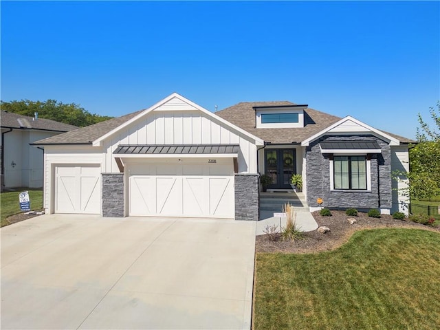 3208 SW Saddlebred Ter, Lees Summit, MO 64082 - view of front facade featuring french doors, board and batten siding, stone siding, a shingled roof, and a front lawn