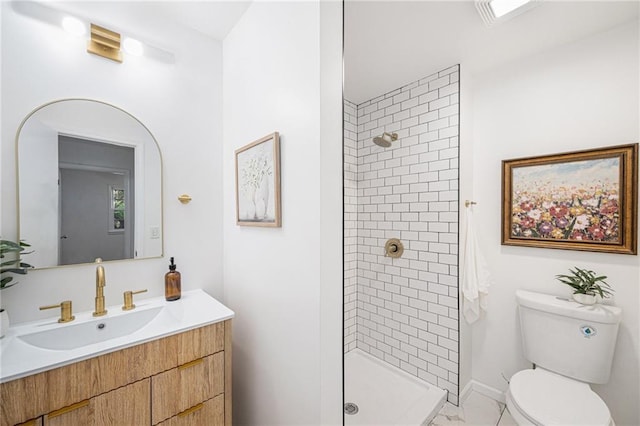bathroom with toilet, a stall shower, vanity, baseboards, and marble look tile flooring