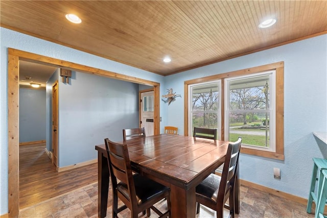 dining room featuring wood ceiling, stone finish flooring, baseboards, ornamental molding, and recessed lighting