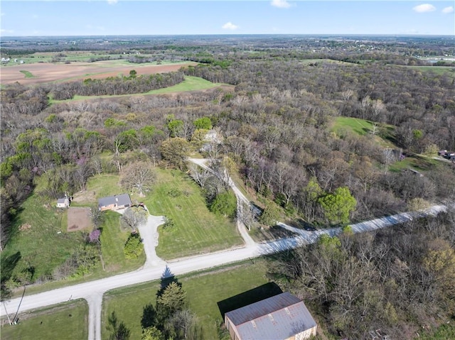 aerial view featuring a wooded view