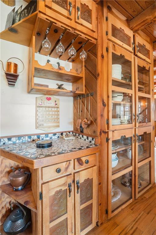 kitchen with light wood-style floors and open shelves