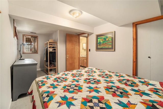 carpeted bedroom featuring a closet