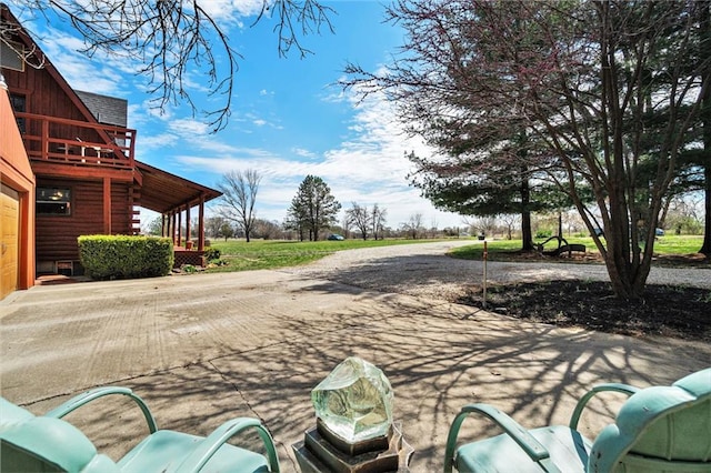 exterior space with concrete driveway