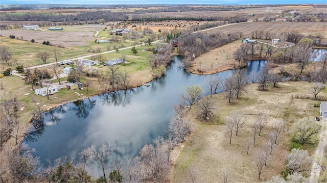 birds eye view of property featuring a water view and a rural view