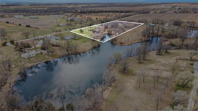 birds eye view of property with a water view and a rural view