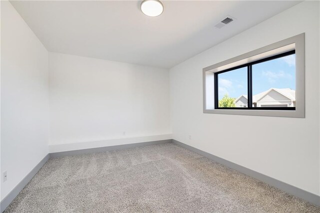 815 W Solomon Dr, Lone Jack, MO 64086 - empty room featuring carpet floors and baseboards