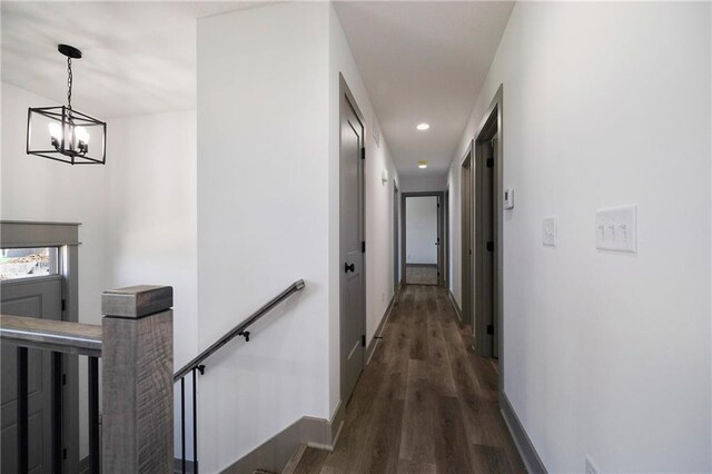815 W Solomon Dr, Lone Jack, MO 64086 - corridor featuring an upstairs landing, wood finished floors, a chandelier, baseboards, and recessed lighting