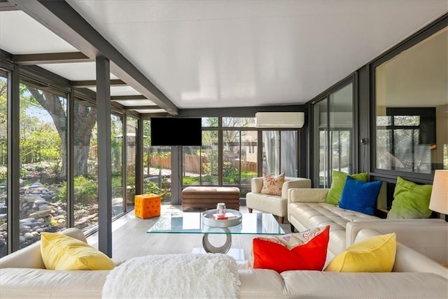 sunroom / solarium with outdoor lounge area, a wall of windows, and wood finished floors