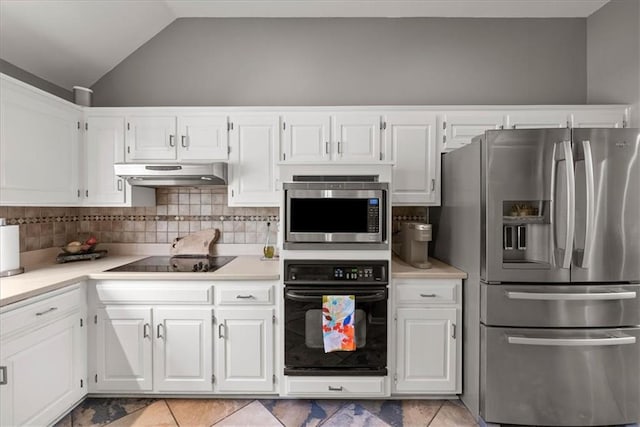 kitchen featuring light countertops, decorative backsplash, under cabinet range hood, and black appliances