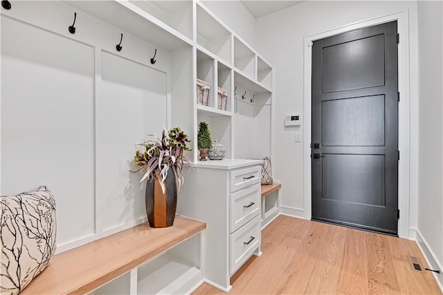 mudroom with visible vents and light wood-style flooring