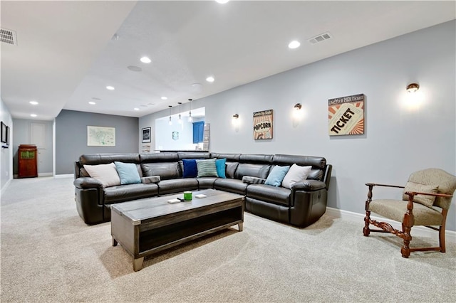 living room featuring recessed lighting, light colored carpet, and visible vents